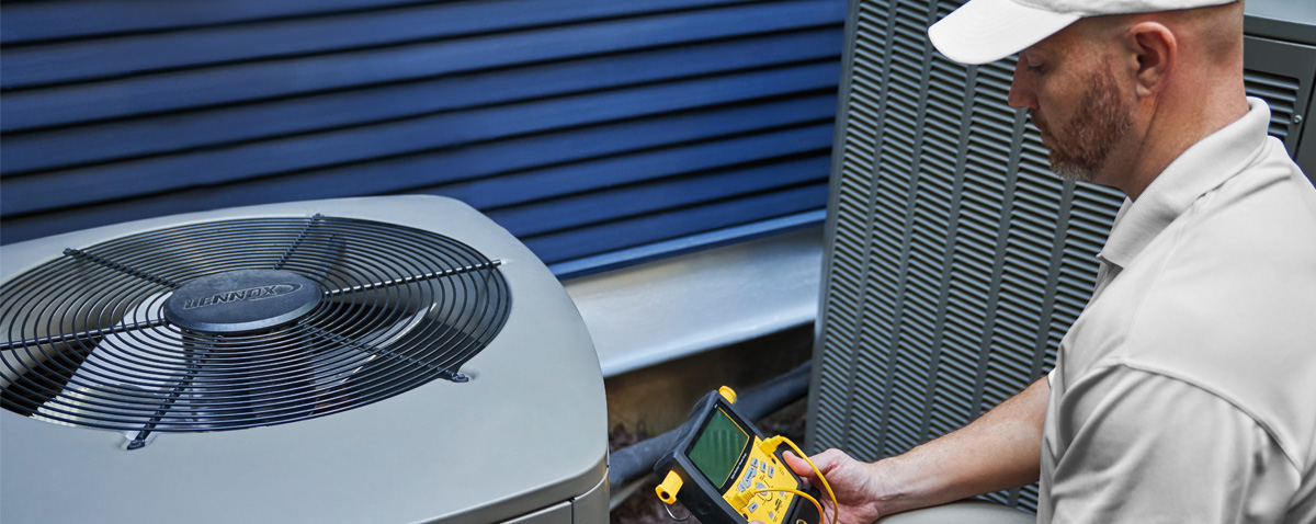 technician checking ac capacitor