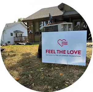Community member holding a Feel the Love nomination sign