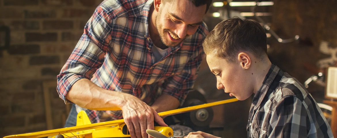 a father and son working on a project