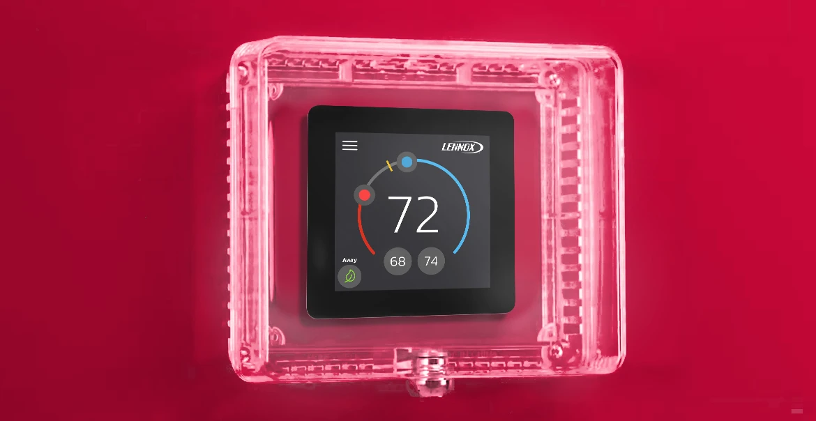 Digital thermostat secured inside a clear thermostat lockbox to prevent unauthorized temperature changes.